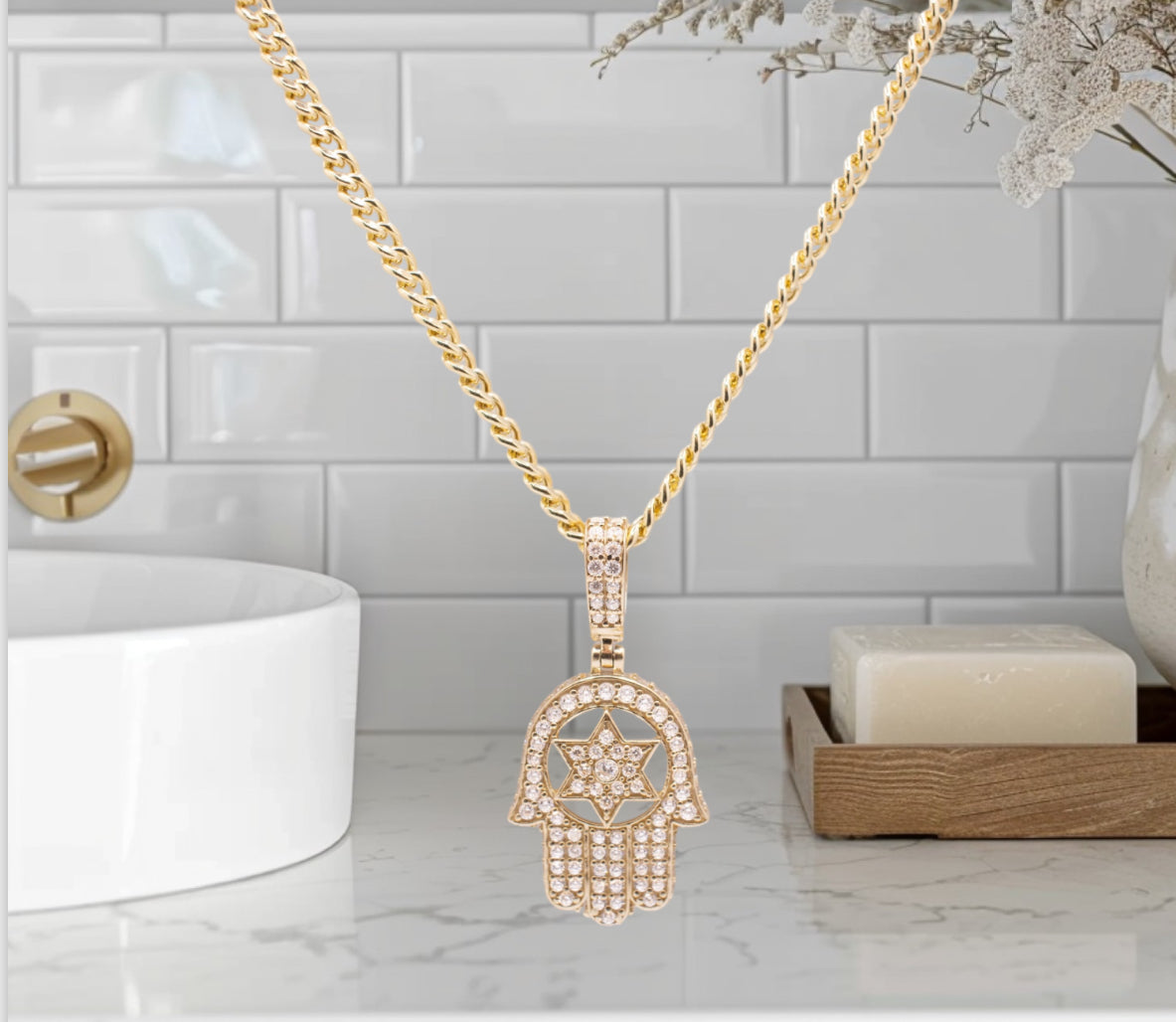 Hamsa pendant surrounded by CZ stones