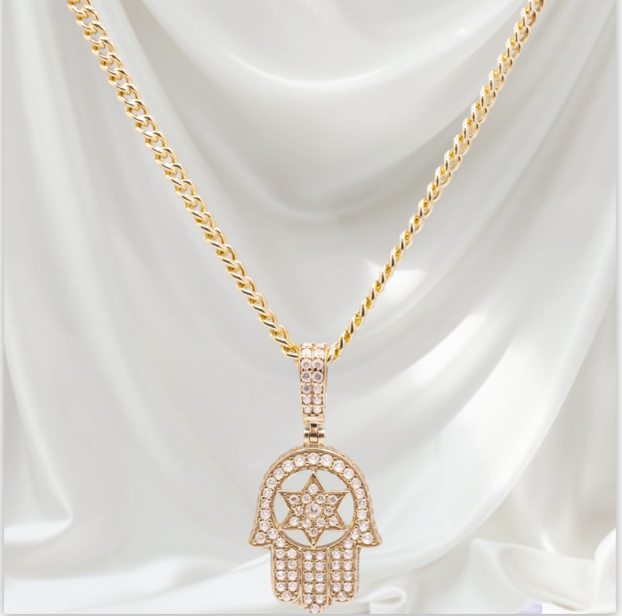 Hamsa pendant surrounded by CZ stones