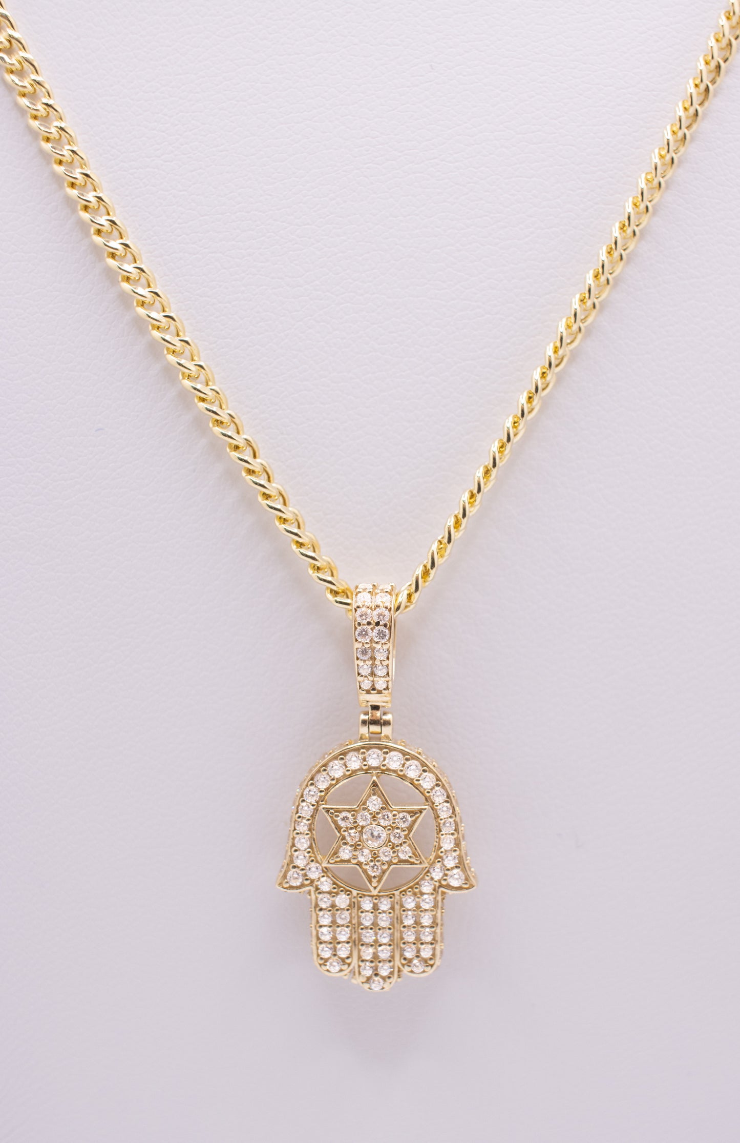 Hamsa pendant surrounded by CZ stones